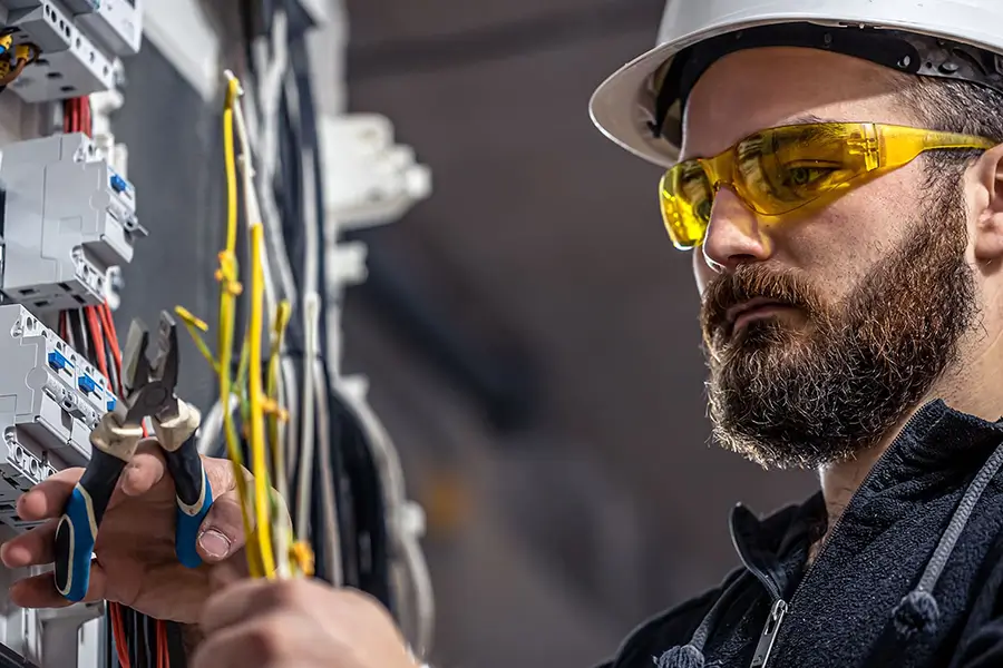 Electrician working on industrial power supply