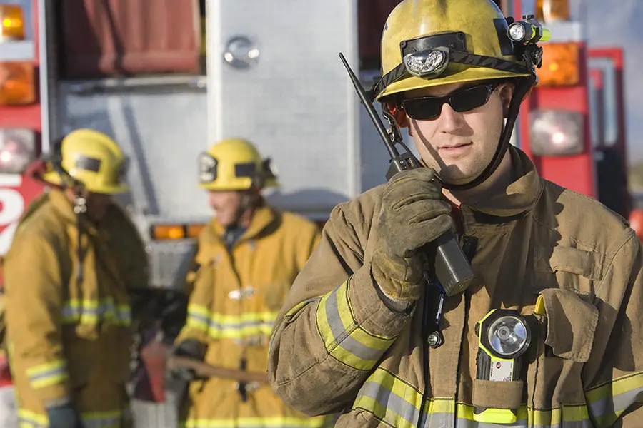 firefighter communicating with radio